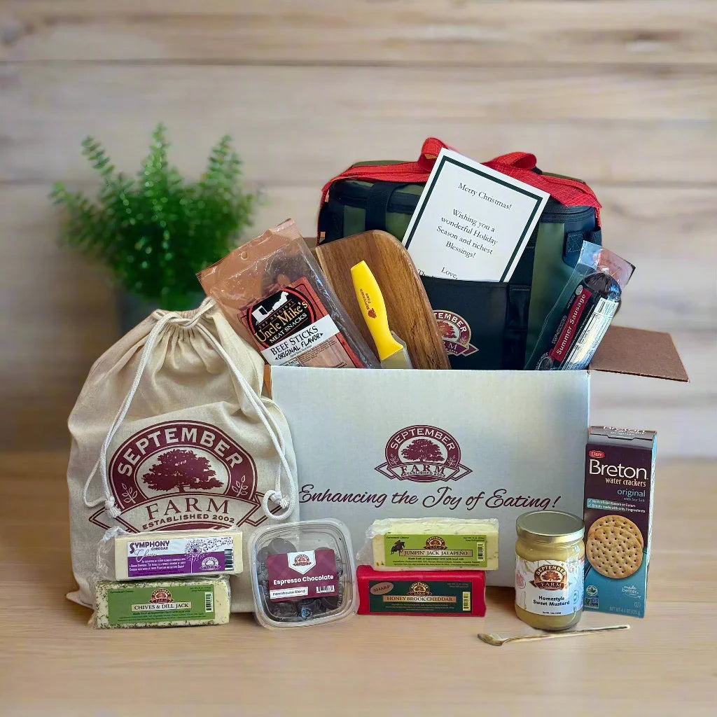 Gift box with September Farm branding on a wooden surface