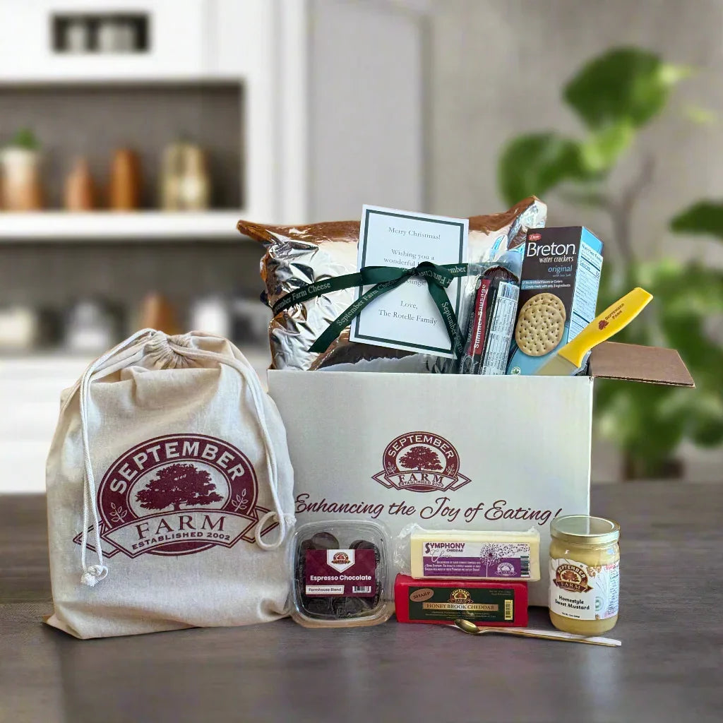 Box of September Farm products on a wooden surface with a branded bag.